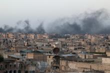Smoke rises after airstrikes on the rebel-held al-Sakhour neighborhood of Aleppo, Syria April 29, 2016. PHOTO BY REUTERS/Abdalrhman Ismail