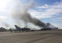 Smoke rises after a Greek F-16 fighter plane crashed during NATO training at the Albacete air base in Albacete, Spain, January 26, 2015. PHOTO BY REUTERS/Cadena Ser