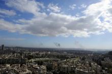 A general view shows rising smoke after strikes on Aleppo city, Syria, December 3, 2016. PHOTO BY REUTERS/Omar Sanadiki