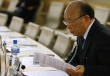 North Korea's ambassador to the United Nations So Se Pyong reads his notes before a session of the Human Rights Council on the report of the Commission of Inquiry on Human Rights in North Korea at the United Nations in Geneva