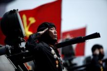 A soldier salutes from atop an armoured vehicle as it drives past the stand with North Korean leader Kim Jong Un during a military parade marking the 105th birth anniversary of country's founding father Kim Il Sung, in Pyongyang, April 15, 2017. PHOTO BY REUTERS/Damir Sagolj