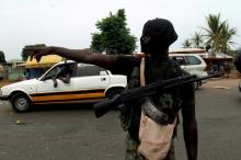 A mutinying soldier gestures as he stands guard at the checkpoint on the entrance to Bouake, Ivory Coast, May 15, 2017. PHOTO BY REUTERS/Luc Gnago