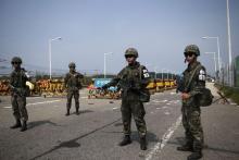 South Korean soldiers stand guard at a checkpoint on the Grand Unification Bridge which leads to the truce village Panmunjom, just south of the demilitarized zone separating the two Koreas, in Paju, South Korea, August 24, 2015. PHOTO BY REUTERS/Kim Hong-Ji