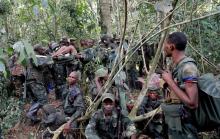 Congolese soldiers from the Armed Forces of the Democratic Republic of Congo (FARDC) rest in an ADF rebel camp, near the town of Kimbau, North Kivu Province, Democratic Republic of Congo, February 19, 2018. PHOTO BY REUTERS/Goran Tomasevic