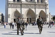 French soldiers patrol outside the Notre Dame Cathedral as part of the "Vigipirate" security plan in Paris, April 22, 2015. PHOTO BY REUTERS/Charles Platiau