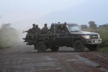 Soldiers from the Democratic Republic of Congo (DRC) arrive on an open military truck near the town of Kibumba at its border with Rwanda after fighting broke out in the Eastern Congo town, June 11, 2014. PHOTO BY REUTERS/Kenny Katombe