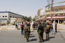 Iraqi security forces gather at the site of a suicide bomb blast in Baghdad al-Jadida, Iraq, September 27, 2016. PHOTO BY REUTERS/Ahmed Saad