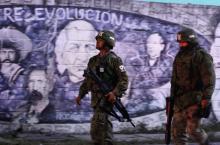 Soldiers stand guard next to at a crime scene, where men were killed inside a home by unknown assailants, in the municipality of San Nicolas de los Garza, Mexico, January 27, 2018. Picture taken January 27, 2018. PHOTO BY REUTERS/Jorge Lopez