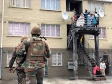Soldiers patrol against gang violence in Manenberg township, Cape Town, South Africa, July 18, 2019. PHOTO BY REUTERS/Shafiek Tassiem