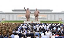 People and soldiers gather to offer flowers to the statues of state founder Kim Il Sung and former leader Kim Jong Il on the Day of Songun at Mansu hill, Pyongyang, North Korea, in this undated photo released by North Korea's Korean Central News Agency (KCNA) on August 26, 2018. PHOTO BY REUTERS/KCNA