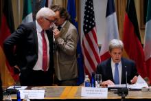 German Foreign Minister Frank-Walter Steinmeier (L) and United States Secretary of State John Kerry prepare for a meeting of foreign ministers from Germany, the UK, France, Italy and the European Union at Tufts University in Medford, Massachusetts, U.S., September 24, 2016. PHOTO BY REUTERS/Brian Snyder