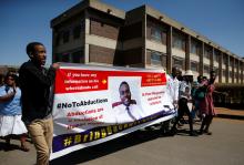 Striking healthcare workers march to protest over the disappearance of Peter Magombeyi, the leader of their union, outside a hospital in Harare, Zimbabwe, September 18, 2019. PHOTO BY REUTERS/Philimon Bulawayo