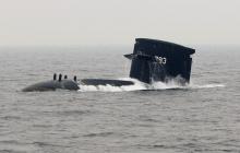 A Taiwan Navy SS-793 Hai Lung diesel-electric submarine emerges from underwater during a naval demonstration near a military naval base in Kaohsiung, southern Taiwan, January 22, 2013. PHOTO BY REUTERS/Pichi Chuang