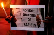 Supporters of India's main opposition Congress party participate in a candle light vigil as they protest against the rape of an eight-year-old girl in Kathua near Jammu, and a teenager in Unnao, Uttar Pradesh state, in Ahmedabad, India, April 13, 2018. PHOTO BY REUTERS/Amit Dave