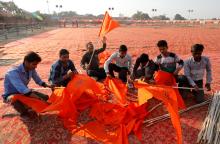 Supporters of the Vishva Hindu Parishad (VHP), a Hindu nationalist organisation, prepare flags at the venue of Sunday's "Dharma Sabha" or a religious congregation organised by VHP, in Ayodhya, Uttar Pradesh, India, November 24, 2018. PHOTO BY REUTERS/Pawan Kumar
