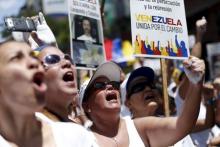 Opposition supporters shout during a rally against the government of Venezuela's President Nicolas Maduro, and in support of the political leaders in prison, in Caracas, May 30, 2015. PHOTO BY REUTERS/Carlos Garcia Rawlins