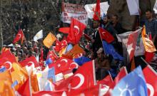 Supporters of the ruling AK Party wave Turkish and party flags during an election rally in Konya, central Turkey