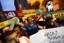 Supporters celebrate early election results outside the pro-Kurdish Peoples' Democratic Party (HDP) headquarters in Istanbul, Turkey, June 7, 2015. PHOTO BY REUTERS/Murad Sezer