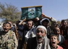 Followers of the Houthi movement recite prayers as they carry the coffin of a fellow fighter during his funeral in Sanaa, January 27, 2015. PHOTO BY REUTERS/Khaled Abdullah
