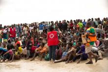 Survivors of Cyclone Idai, listen to a volunteer from Mozambique Red Cross, after arriving to an evacuation centre in Beira, Mozambique, March 21, 2019. PHOTO BY REUTERS/Denis Onyodi/Red Cross Red Crescent Climate Centre