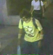 A man wearing a yellow T-shirt and carrying a backpack is seen walking near the Erawan shrine, where a bomb blast killed 22 people on Monday, in Bangkok, Thailand in this handout still image taken from closed-circuit television (CCTV) footage, August 18, 2015. PHOTO BY REUTERS/Thai Police