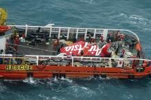 The tail of AirAsia QZ8501 passenger plane is seen on the deck of the rescue ship Crest Onyx after it was lifted from the sea bed, south of Pangkalan Bun, Central Kalimantan, January 10, 2015. PHOTO BY REUTERS/Suharso