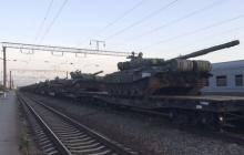 Tanks are seen on a freight train shortly after its arrival at a railway station in the Russian southern town of Matveev Kurgan, near the Russian-Ukrainian border in Rostov region, Russia, May 26, 2015. Picture taken with a mobile phone. PHOTO BY REUTERS/Maria Tsvetkova