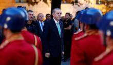 Turkish President Tayyip Erdogan reviews a guard of honour as he arrives to the Turkish Parliament in Ankara, Turkey, July 22, 2016. PHOTO BY REUTERS/Umit Bektas