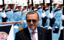 Turkish President Tayyip Erdogan reviews a guard of honour during a welcoming ceremony at the Presidential Palace in Ankara, Turkey, August 5, 2016. PHOTO BY REUTERS/Umit Bektas