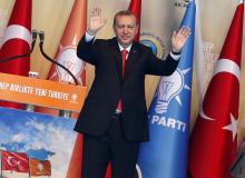 Turkey's Prime Minister Tayyip Erdogan greets his supporters during the Extraordinary Congress of the ruling AK Party (AKP) to choose a new leader of the party, ahead of his inauguration as president, in Ankara