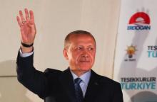 Turkish President Tayyip Erdogan greets his supporters at the AKP headquarters in Ankara, Turkey, June 25, 2018. PHOTO BY REUTERS/Umit Bektas