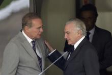 Brazil's Vice President Michel Temer peaks with Brazilian Senate Renan Calheiros after a meeting with Opposition Senator Aecio Neves of the Brazilian Social Democracy Party (PSDB) in Brasilia, Brazil, April 27, 2016. PHOTO BY REUTERS/Ueslei Marcelino