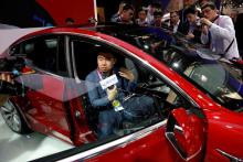 The Tesla Model 3 is displayed during a media preview of the Auto China 2018 motor show in Beijing, China, April 25, 2018. PHOTO BY REUTERS/Damir Sagolj