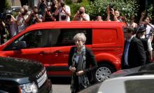 Britain's Prime Minister Theresa May arrives at the Finsbury Park Mosque after a van was driven at muslims outside the mosque in North London, Britain, June 19, 2017. PHOTO BY REUTERS/Hannah McKay