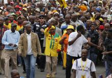 Lesotho's Prime Minister and leader of the All Basotho Convention (ABC) Thomas Thabane (C, yellow top) waves to his supporters during his walkabout in the capital Maseru, February 26, 2015. PHOTO BY REUTERS/Siphiwe Sibeko
