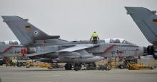 A technician works on a German Tornado jet at the air base in Incirlik, Turkey, January 21, 2016. PHOTO BY REUTERS/Tobias Schwarz