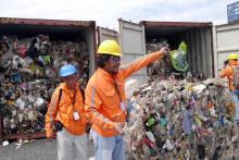 Philippine customs officials inspect cargo containers containing tonnes of garbage shipped by Canada at Manila port, November 10, 2014. PHOTO BY REUTERS/BAN Toxics/Handout