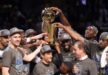 The Golden State Warriors celebrates with the Larry O'Brien Trophy after beating the Cleveland Cavaliers in game six of the NBA Finals at Quicken Loans Arena, Cleveland, OH, USA, June 16, 2015. PHOTO BY USA TODAY Sports/Bob Donnan