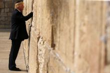 U.S. President Donald Trump places a note in the stones of the Western Wall, Judaism's holiest prayer site, in Jerusalem's Old City, May 22, 2017. PHOTO BY REUTERS/Jonathan Ernst
