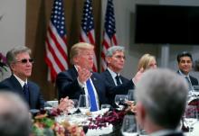 U.S. President Donald Trump attends a dinner with business men and CEO's during the World Economic Forum (WEF) annual meeting in Davos, Switzerland, January 25, 2018. Siemens CEO's Joe Kaeser (C) looks on. PHOTO BY REUTERS/Carlos Barria