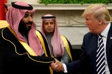 U.S. President Donald Trump shakes hands with Saudi Arabia's Crown Prince Mohammed bin Salman in the Oval Office at the White House in Washington, U.S., March 20, 2018. PHOTO BY REUTERS/Jonathan Ernst