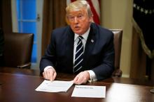 U.S. President Donald Trump speaks about his summit meeting with Russian President Vladimir Putin as he begins a meeting with members of the U.S. Congress at the White House in Washington, July 17, 2018. PHOTO BY REUTERS/Leah Millis
