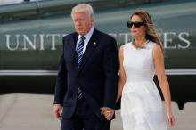 President Donald Trump and first lady Melania Trump hold hands as they arrive to board Air Force One for travel to Rome from Ben Gurion International Airport in Tel Aviv, Israel. PHOTO BY REUTERS/Jonathan Ernst