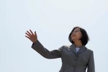 Taiwanese President Tsai Ing-wen waves her hand as she boards the nation's first domestically built Tuo Jiang twin-hull stealth missile corvette at Suao Naval Base in Yilan, Taiwan, June 4, 2016. PHOTO BY REUTERS/Tyrone Siu