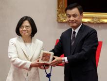Taiwan's President Tsai Ing-wen (L) receives an official seal after swearing in at the Presidential Office in Taipei, Taiwan, May 20, 2016. PHOTO BY REUTERS/Taipei Photojournalists Association