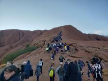 Tourists crowd a trail as they attempt to climb the Uluru, a large sandstone rock formation at Uluru-Kata Tjuta National Park, Northern Territory, Australia September 25, 2019 in this image obtained from social media. PHOTO BY REUTERS/Koki 