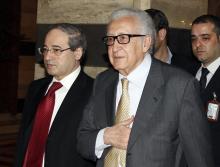United Nations Envoy Lakhdar Brahimi (C) returns to a hotel after meeting Syria's President Bashar al-Assad