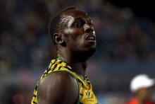 Usain Bolt of Jamaica reacts after Jamaica placed second behind the U.S. in the 4x100 meters race at the IAAF World Relays Championships in Nassau, Bahamas, May 2, 2015. PHOTO BY REUTERS/Mike Segar