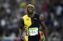 Usain Bolt (JAM) of Jamaica celebrates after winning the race in Rio de Janeiro, Brazil, August, 2016. PHOTO BY REUTERS/Dylan Martinez