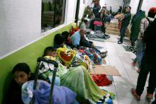 Venezuelan migrants take refuge inside the building of the International Center of Border Services on the Rumichaca International Bridge, in Tulcan, Ecuador, August 18, 2018. PHOTO BY REUTERS/Luisa Gonzalez